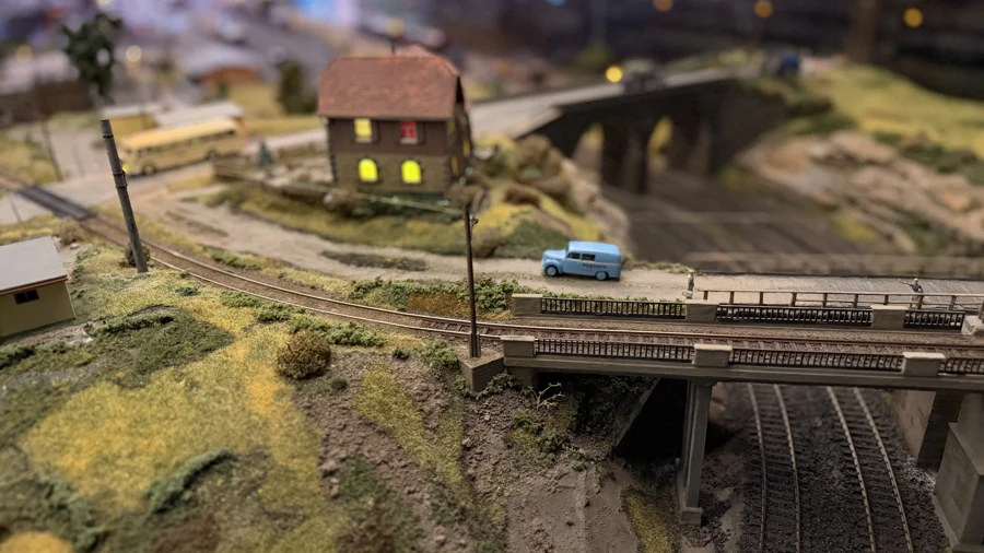 Railway bridge crossing above a wooded cutting