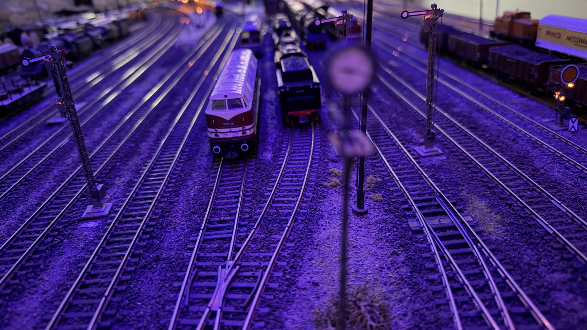 Station tracks under blue evening lighting
