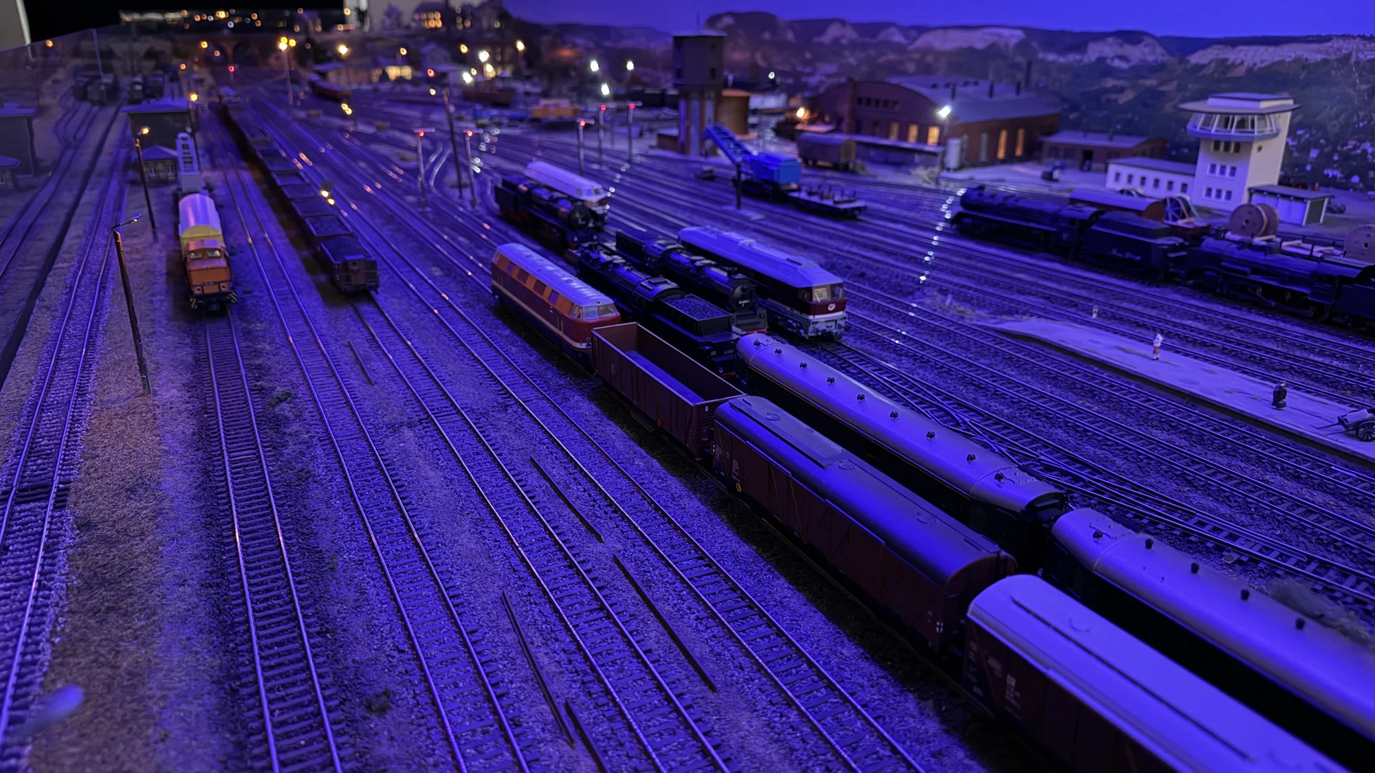 A wide view across the railway yard at night