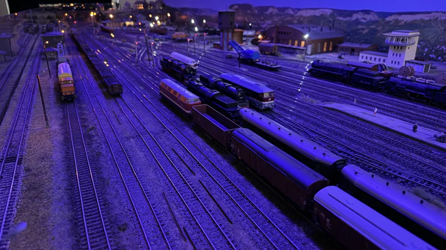 A wide view across the railway yard at night