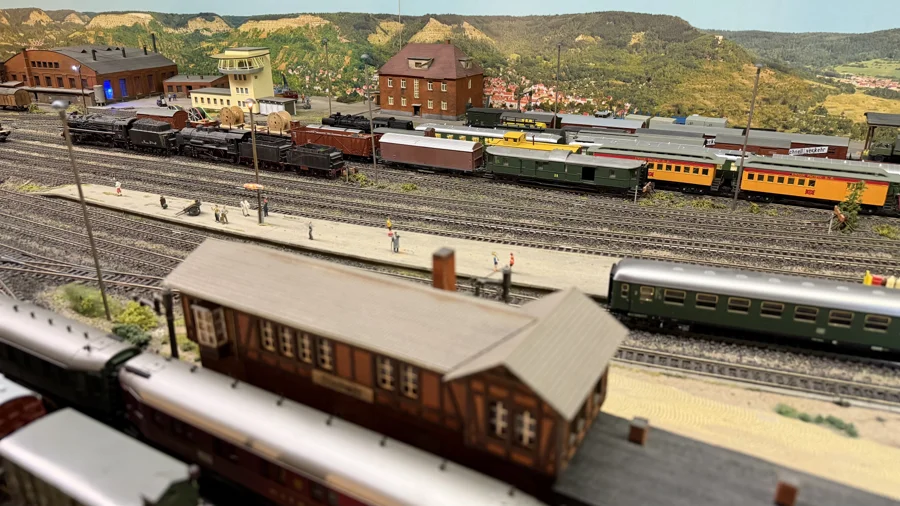 Station roof in front of a busy locomotive yard