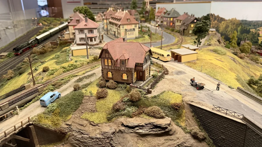 A hillside village with a signal box and winding roads