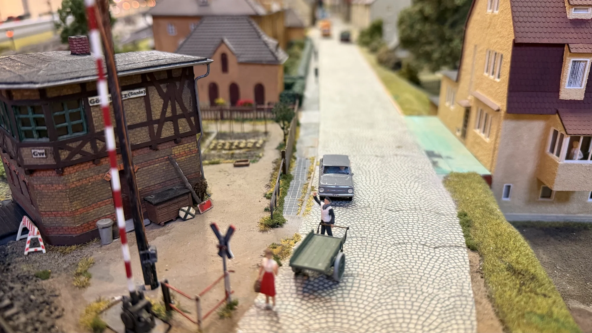 A miniature street with tram tracks and timber-framed houses