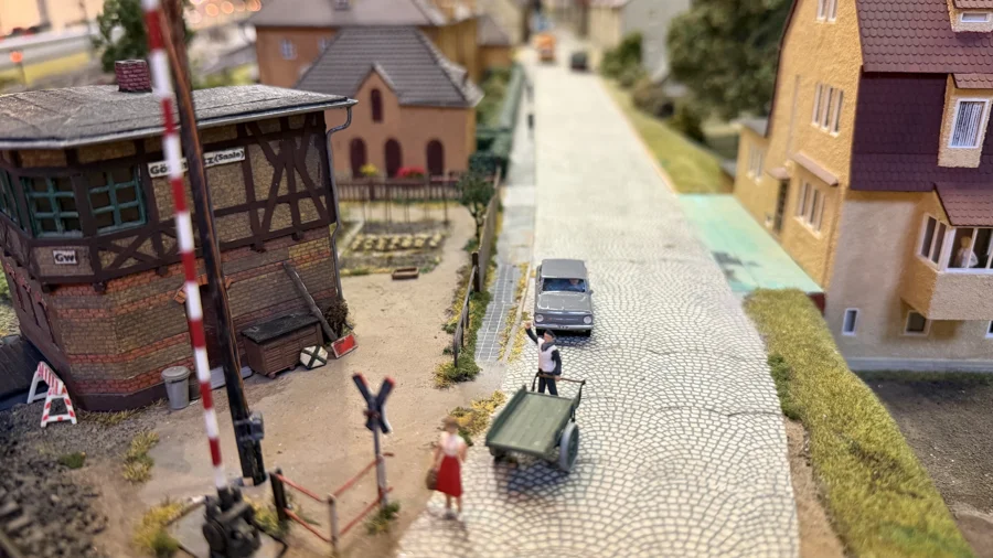 A miniature street with tram tracks and timber-framed houses